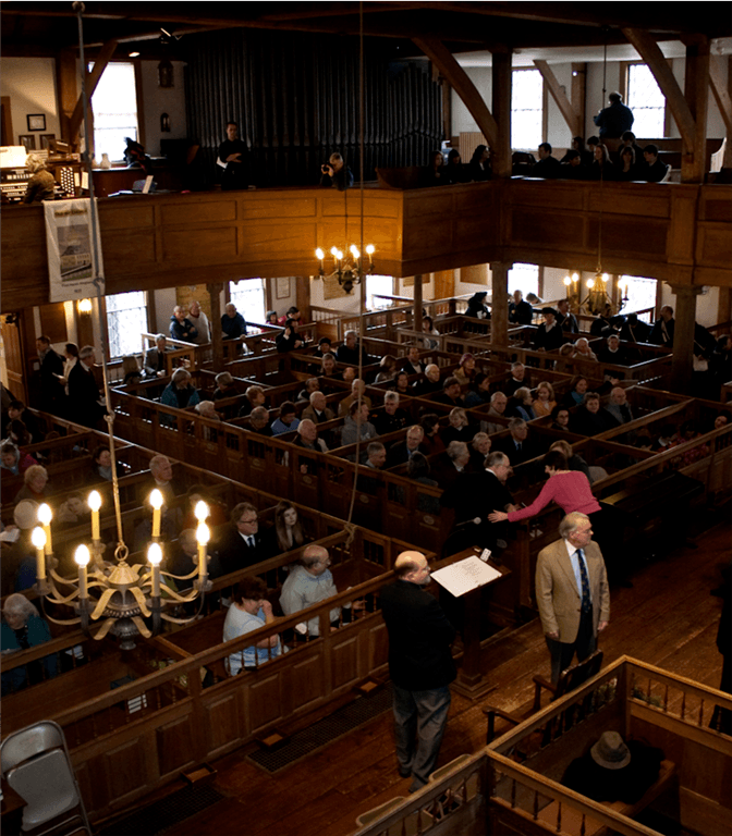 Audience in Hingham's historic Old Ship Church
